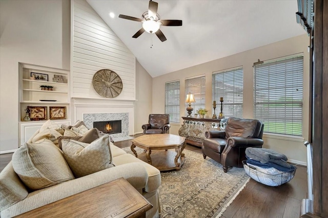 13538 Scenic Glade Dr, Houston, TX 77059 - living room featuring wood finished floors, high vaulted ceiling, ceiling fan, baseboards, and a tile fireplace
