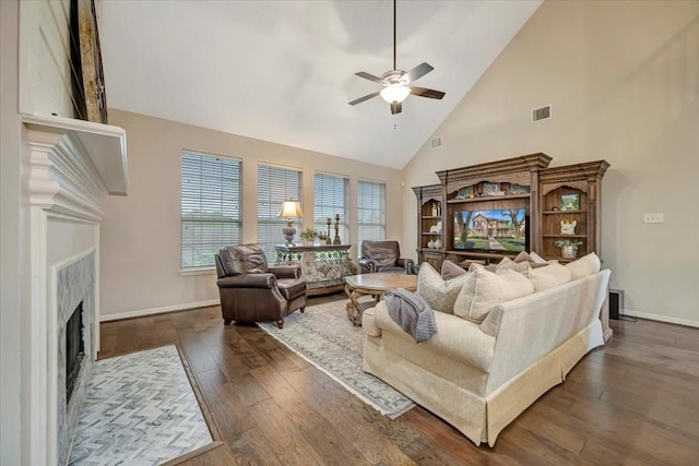 13538 Scenic Glade Dr, Houston, TX 77059 - living room featuring ceiling fan, high vaulted ceiling, dark wood finished floors, a premium fireplace, and baseboards