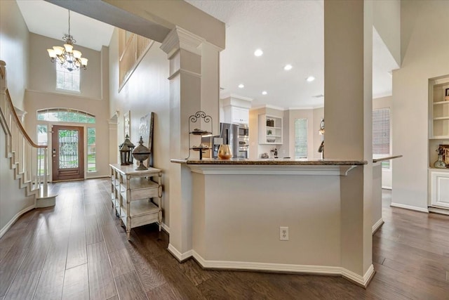 13538 Scenic Glade Dr, Houston, TX 77059 - entryway featuring a chandelier, dark wood-style flooring, baseboards, stairway, and recessed lighting