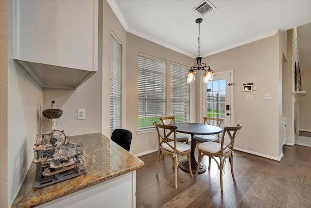 13538 Scenic Glade Dr, Houston, TX 77059 - dining area featuring crown molding, dark wood-style floors, baseboards, and a chandelier
