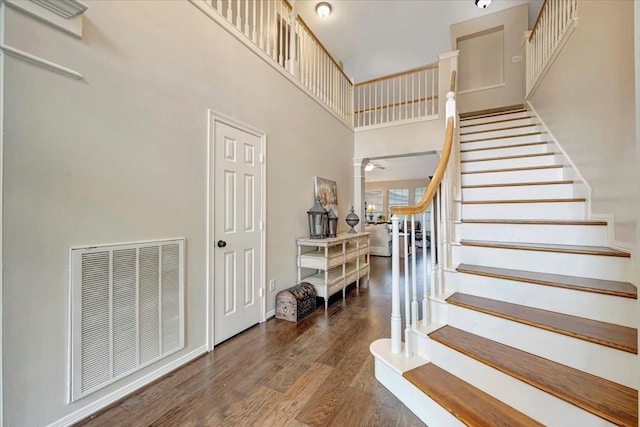 13538 Scenic Glade Dr, Houston, TX 77059 - stairway with a towering ceiling, wood finished floors, ornate columns, and baseboards