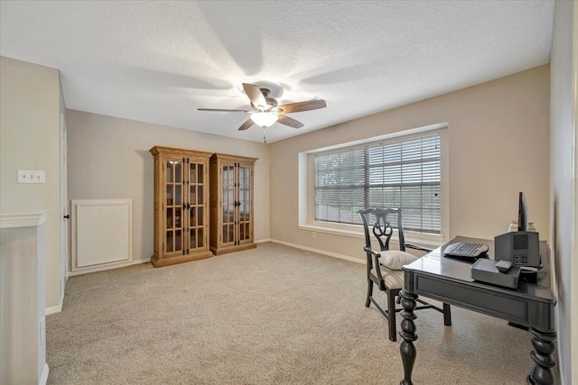 13538 Scenic Glade Dr, Houston, TX 77059 - carpeted home office featuring a ceiling fan, baseboards, and a textured ceiling