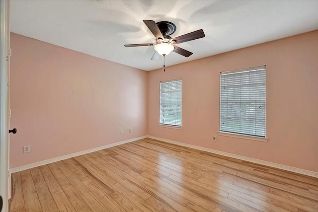 13538 Scenic Glade Dr, Houston, TX 77059 - spare room with ceiling fan, baseboards, and light wood-style floors