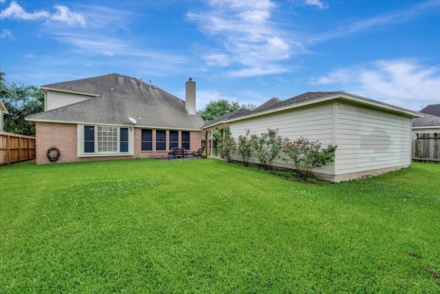 13538 Scenic Glade Dr, Houston, TX 77059 - back of property featuring brick siding, a chimney, and a shingled roof