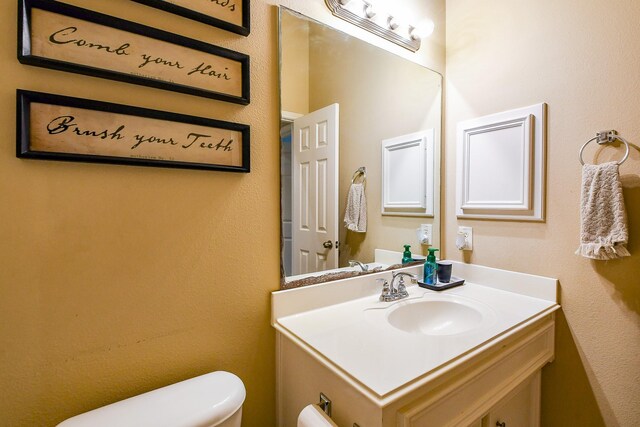 629 Pelican Harbour Dr, Texas City, TX 77590 - half bathroom featuring toilet and vanity
