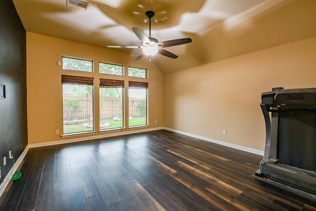 629 Pelican Harbour Dr, Texas City, TX 77590 - unfurnished living room with ceiling fan, baseboards, dark wood-style flooring, and vaulted ceiling