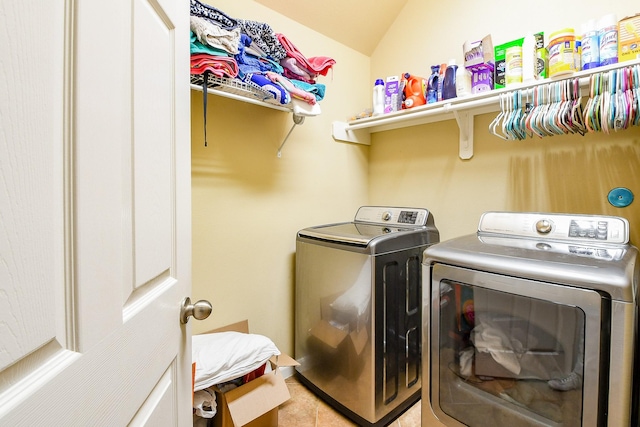 629 Pelican Harbour Dr, Texas City, TX 77590 - clothes washing area featuring washer and clothes dryer and light tile patterned floors
