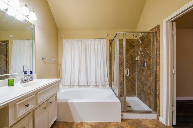 629 Pelican Harbour Dr, Texas City, TX 77590 - full bathroom with lofted ceiling, a stall shower, vanity, a garden tub, and tile patterned flooring