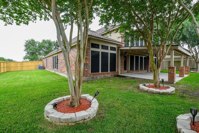 629 Pelican Harbour Dr, Texas City, TX 77590 - back of house with brick siding, a patio area, and a shingled roof