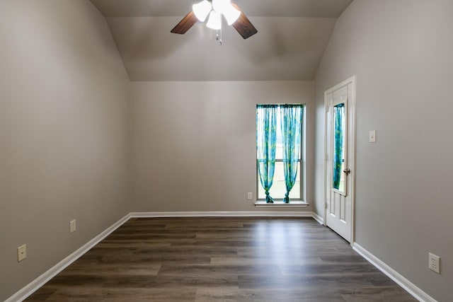 629 Pelican Harbour Dr, Texas City, TX 77590 - spare room with vaulted ceiling, ceiling fan, baseboards, and dark wood-type flooring