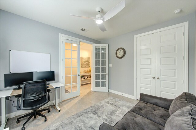 office featuring ceiling fan, french doors, baseboards, light tile patterned floors, and visible vents