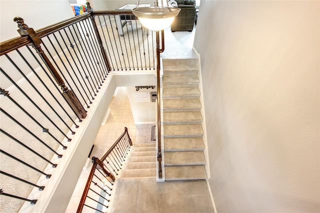 staircase featuring baseboards