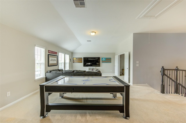 recreation room featuring visible vents, attic access, baseboards, and carpet floors
