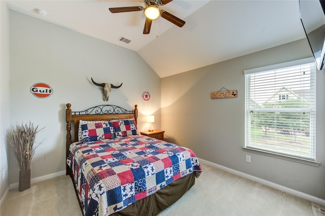 bedroom with carpet floors, visible vents, and multiple windows