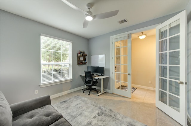 tiled office featuring baseboards, a ceiling fan, french doors, and visible vents