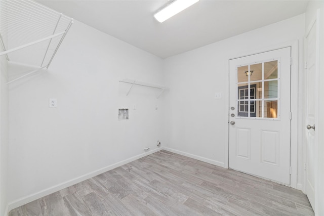 laundry room featuring laundry area, baseboards, hookup for a washing machine, light wood-type flooring, and gas dryer hookup