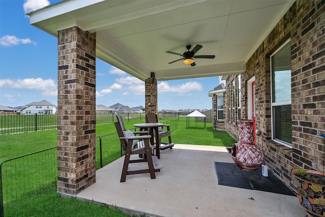 view of patio featuring a fenced backyard and ceiling fan