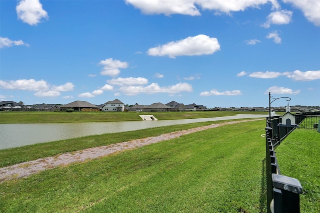 exterior space with a water view and a residential view