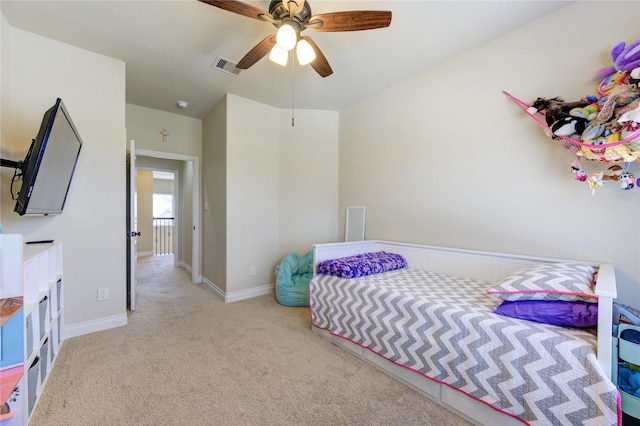bedroom with baseboards, carpet, a ceiling fan, and visible vents