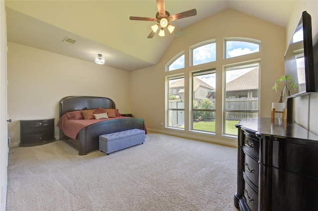 bedroom featuring a ceiling fan, carpet flooring, lofted ceiling, and visible vents