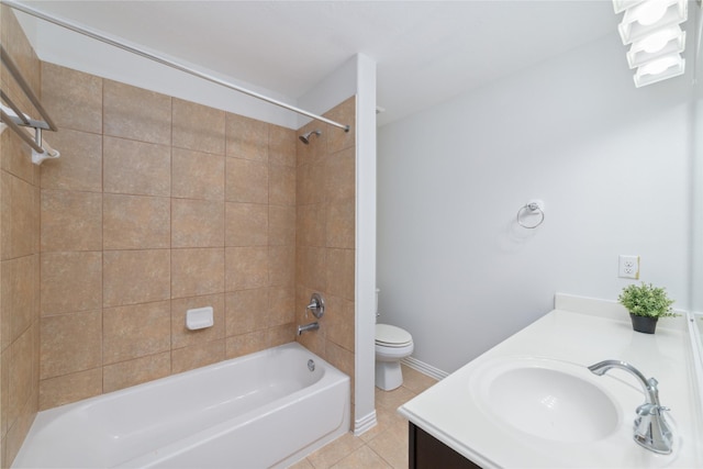 bathroom featuring vanity, toilet, tile patterned floors, shower / bath combination, and baseboards