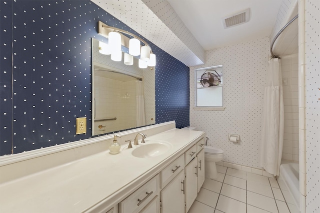 bathroom featuring visible vents, vanity, toilet, wallpapered walls, and tile patterned floors