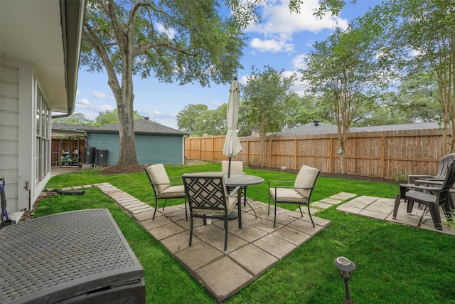 view of patio with a fenced backyard and outdoor dining space