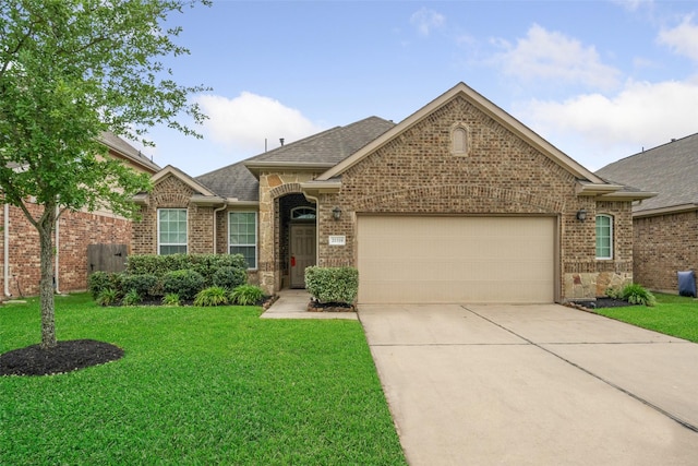 single story home featuring an attached garage, concrete driveway, a front lawn, and brick siding