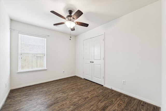 4910 Pacific Ridge Ln, Rosenberg, TX 77469 - unfurnished bedroom with wood finished floors, a closet, baseboards, and ceiling fan