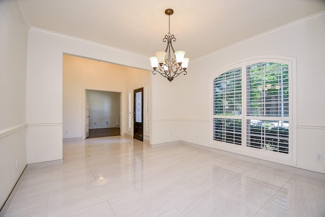 spare room featuring ornamental molding, a chandelier, light tile patterned flooring, and baseboards