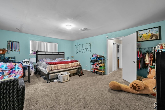 bedroom with carpet floors, a closet, and visible vents
