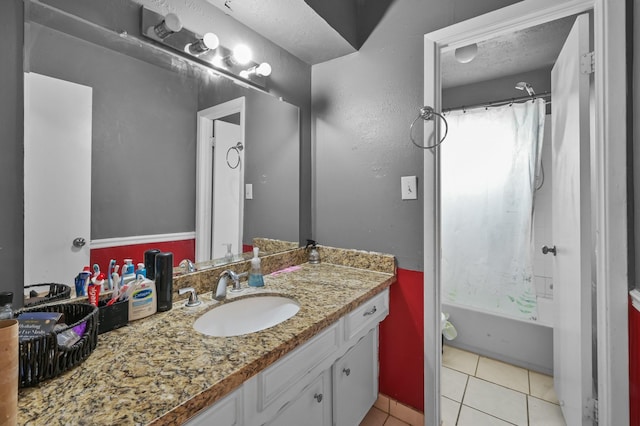 bathroom featuring vanity, tile patterned floors, a textured ceiling, and shower / bath combination with curtain