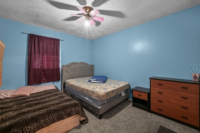 carpeted bedroom with a ceiling fan and a textured ceiling