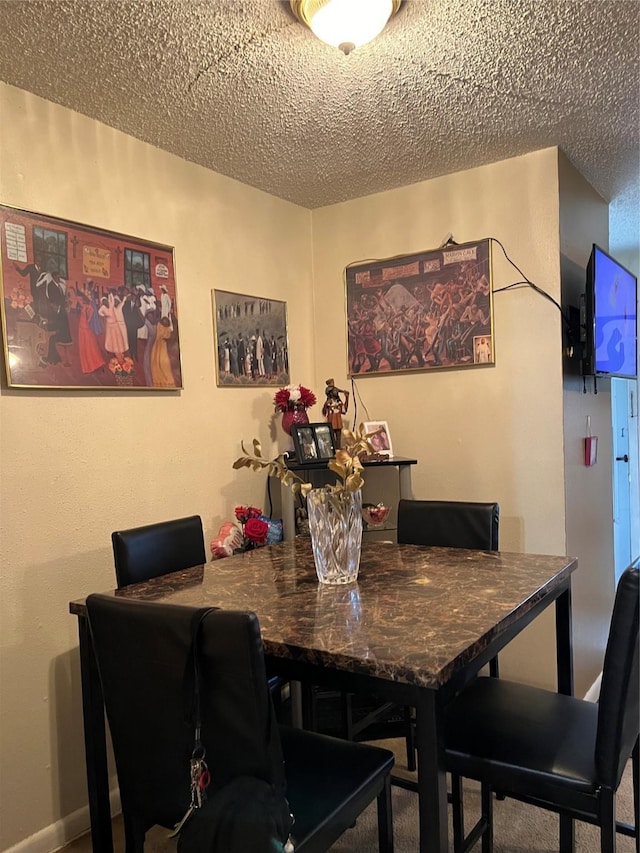 dining area with a textured ceiling