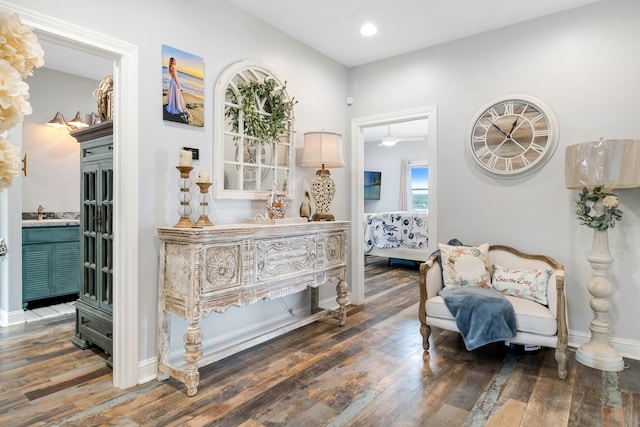 sitting room with recessed lighting, baseboards, and wood finished floors