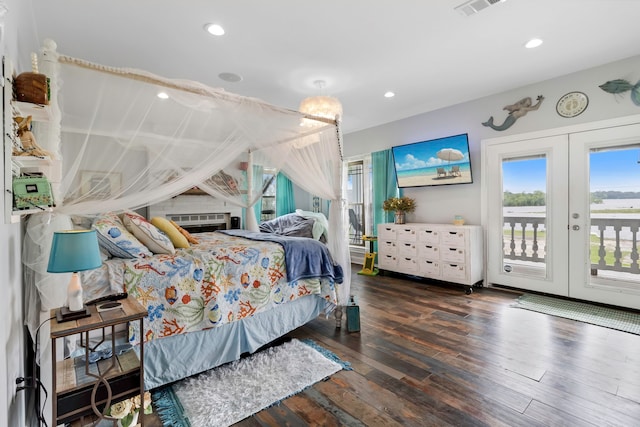 bedroom with visible vents, recessed lighting, access to outside, hardwood / wood-style flooring, and french doors