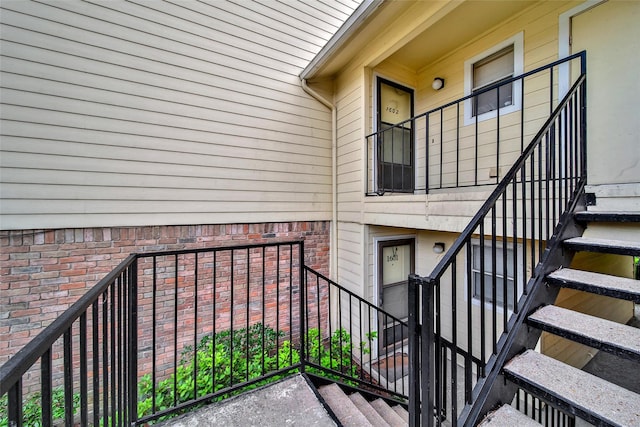 entrance to property with a balcony