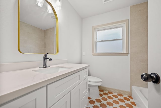 bathroom featuring vanity, baseboards, visible vents, and toilet