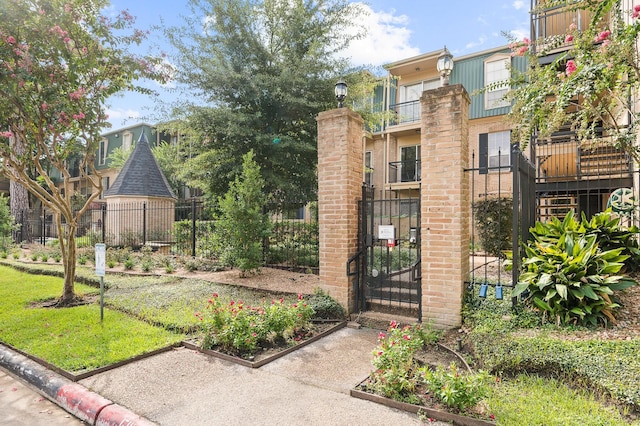 view of gate with fence