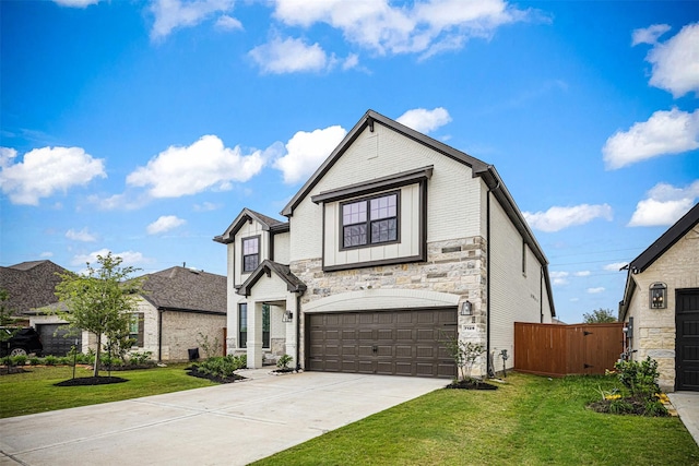 french country home with a garage, a front lawn, fence, stone siding, and concrete driveway