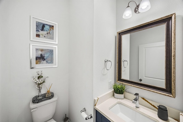 half bath with vanity and toilet