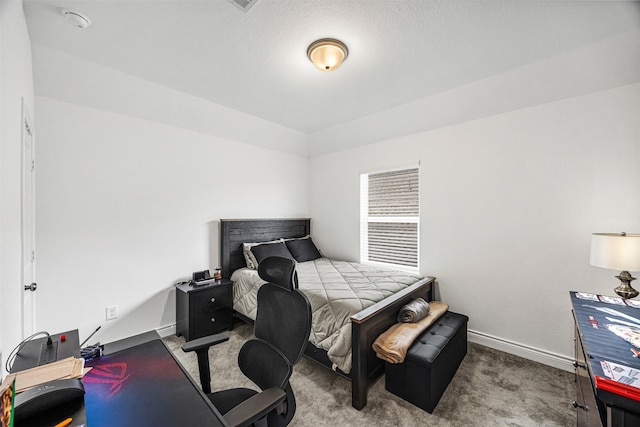 carpeted bedroom with baseboards
