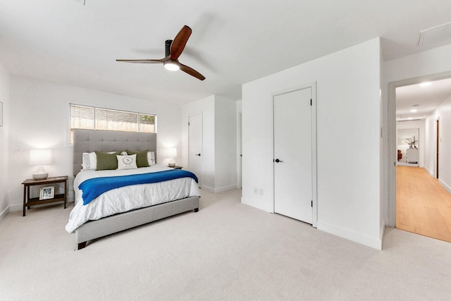 carpeted bedroom with baseboards and a ceiling fan