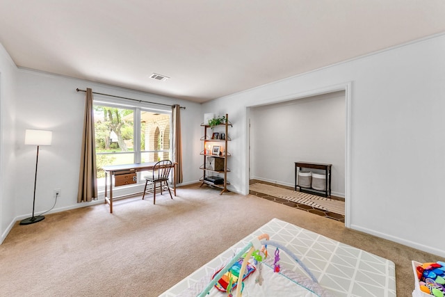 game room with carpet floors, baseboards, visible vents, and ornamental molding