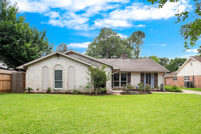 ranch-style home featuring brick siding, central AC unit, a front lawn, and fence