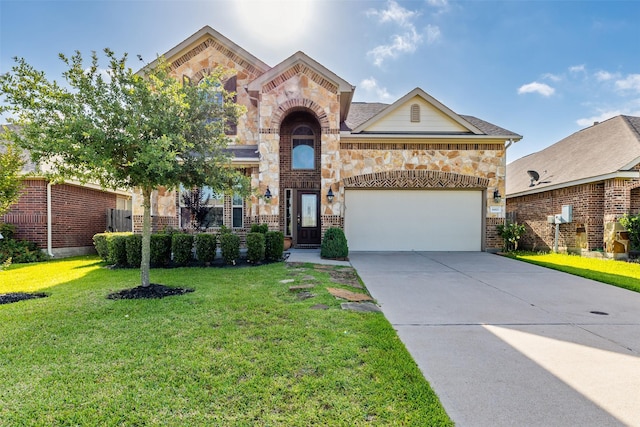 traditional-style house with brick siding, driveway, a front lawn, and a garage