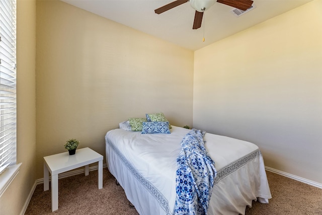 bedroom featuring baseboards, carpet, a ceiling fan, and visible vents