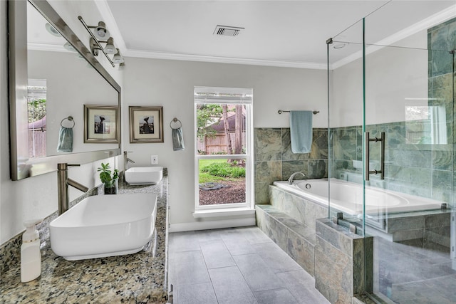 full bathroom with a sink, crown molding, a shower stall, and a bath