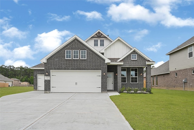 123 Big Spring Dr, Anahuac, TX 77514 - view of front of home featuring board and batten siding, driveway, a front lawn, and brick siding