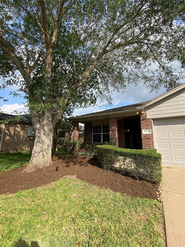 3006 Red Stag Pass, Missouri City, TX 77459 - ranch-style house featuring a garage, concrete driveway, and brick siding